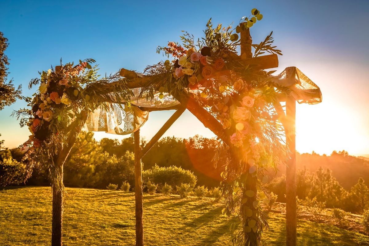 Jewish traditions wedding ceremony. Wedding canopy chuppah or huppah with lens flare